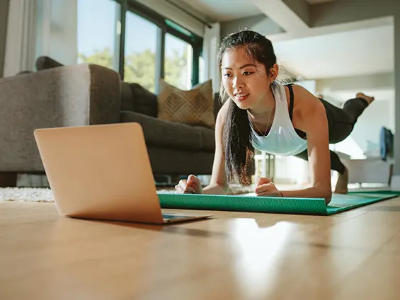Person stretching in a bright minimal room
